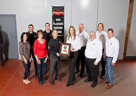 Employees holding award